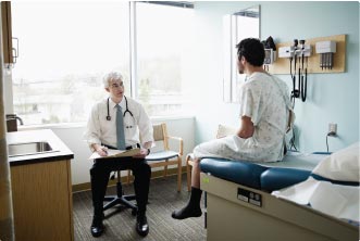 Patient sitting in doctor's office.